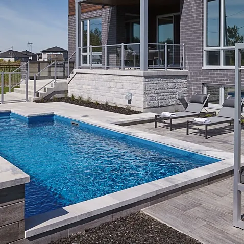 Pool deck with modern coping beside a house